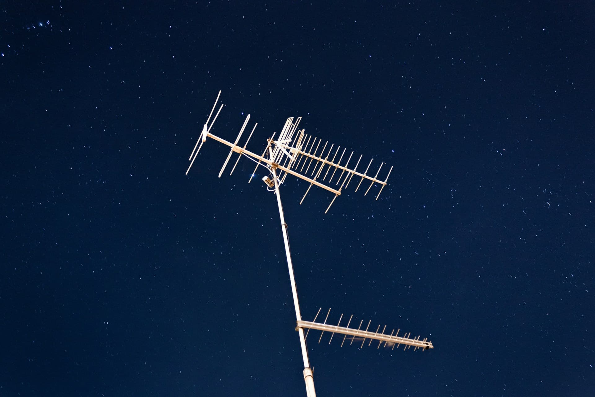 tv aerial against a night sky