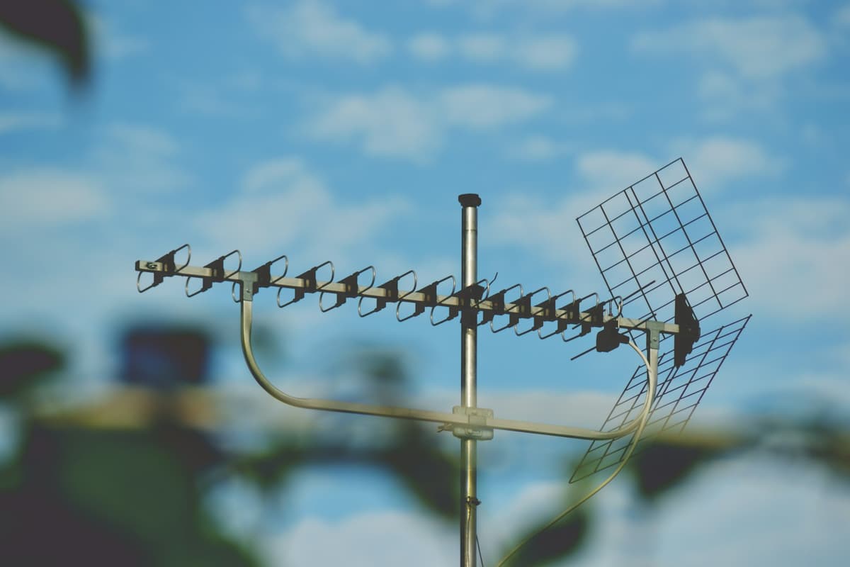 modern aerial on a roof with blue sky behind
