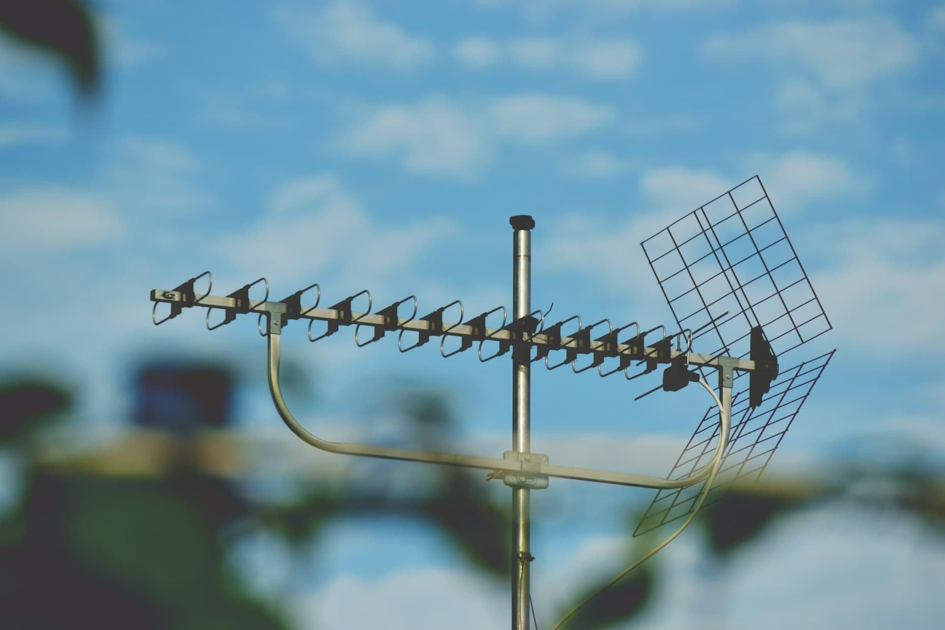 modern aerial on a roof with blue sky behind